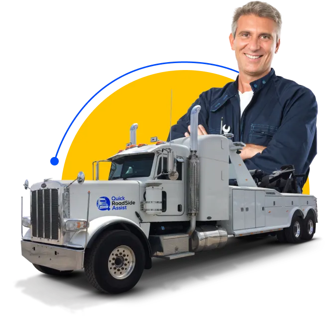 A man with a tow truck in front of a yellow background.